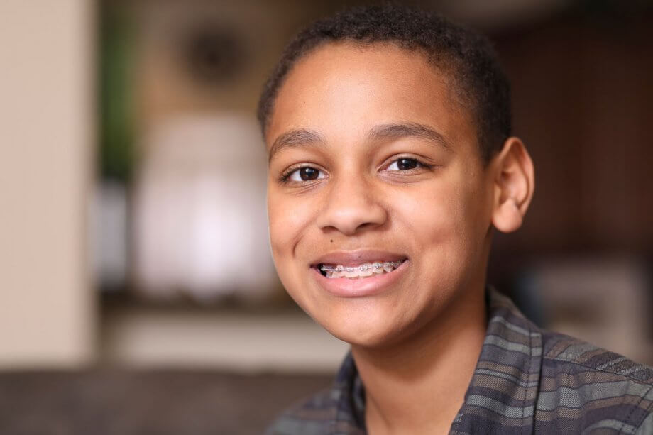 boy with braces smiling