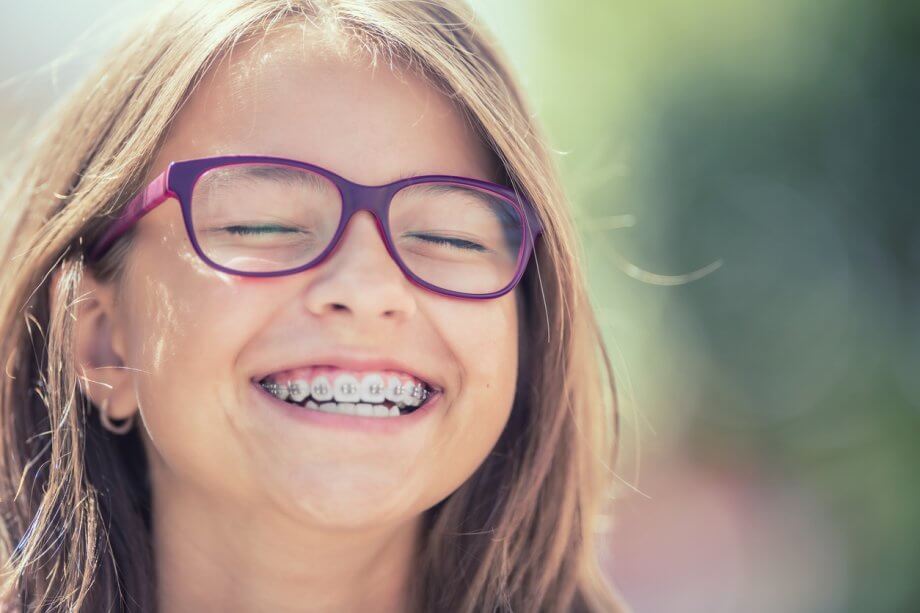 Happy Smiling Teenage Girl with Braces