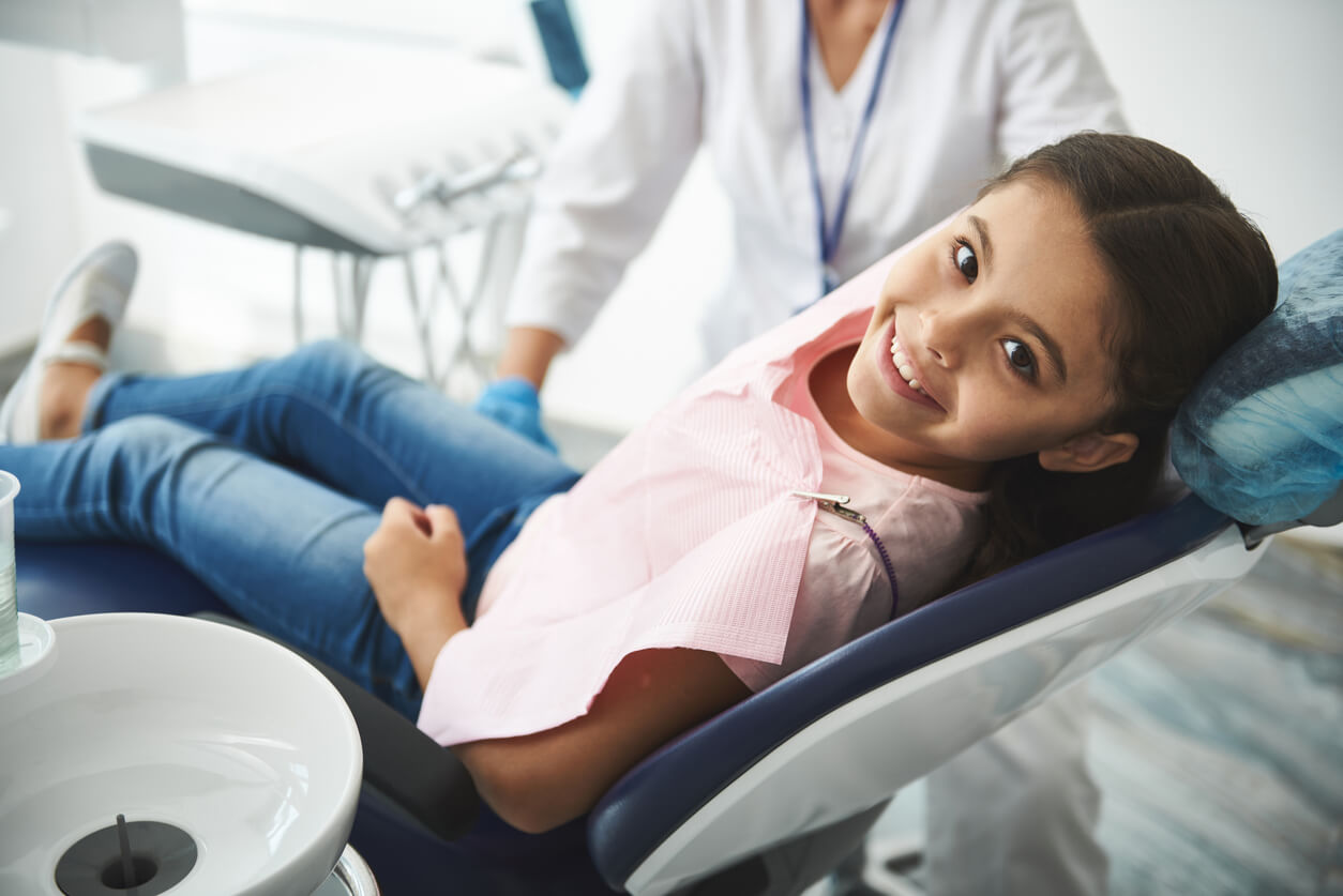 Young Girl In Dentist Chair Waiting For Icon Procedure