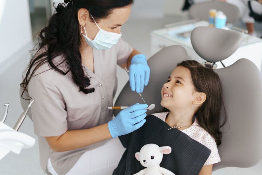 young girl at the dentist in dentist chair